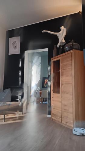 a living room with a room with a couch and a room at Meisterhaus Apartment 2 in Glauchau