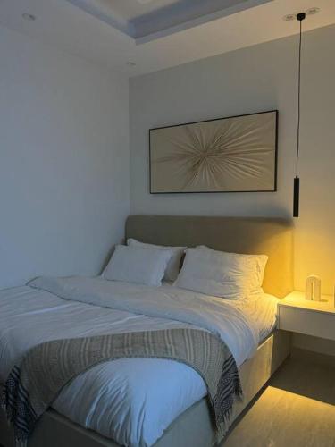 a bedroom with a large bed with at استديو هادئ in Riyadh