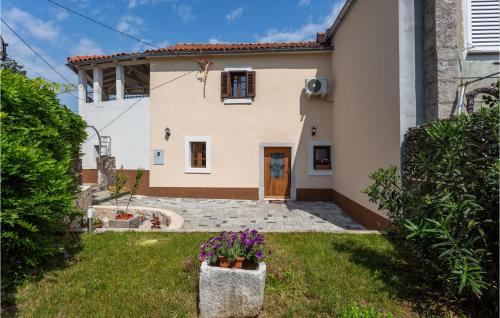 a house with a door and a yard at Amazing Home In Polje With Wifi in Polje