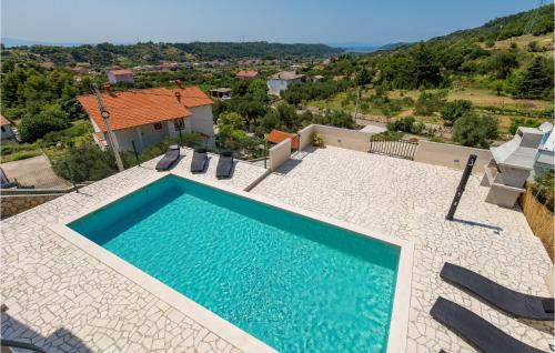 an overhead view of a swimming pool and a house at Cozy Home In Mundanije With Wifi in Mundanije