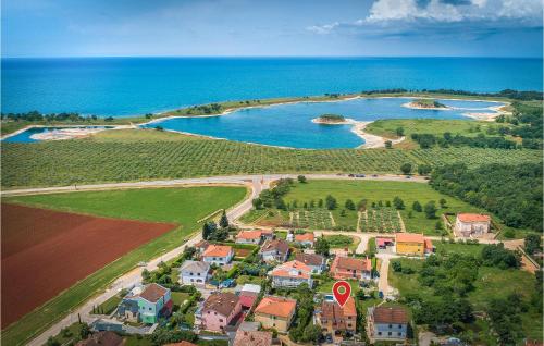 an aerial view of a small town with a lake at Stunning Home In Umag in Umag