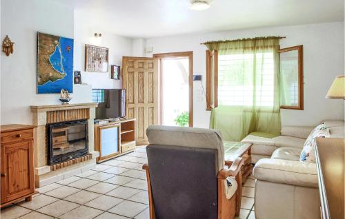 a living room with a couch and a fireplace at Gorgeous Home In Pilar De La Horadada in Pilar de la Horadada