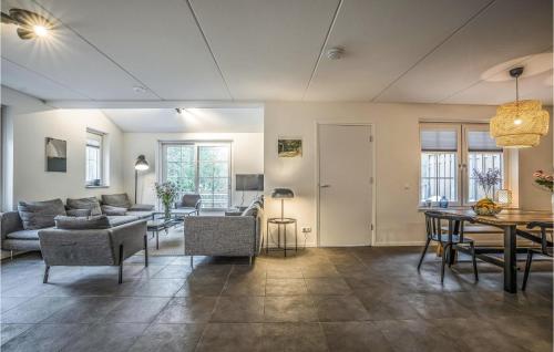 a living room with a couch and a table at Nice Home In Rijssen With Wifi in Rijssen