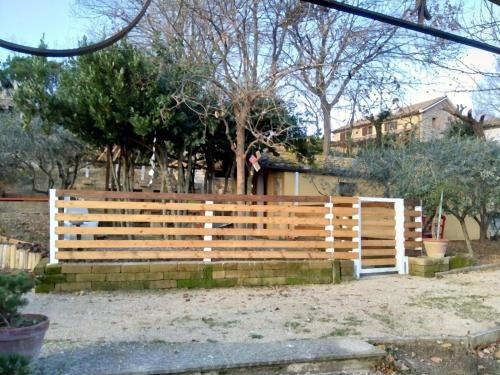 a wooden fence in front of a house at Civettina in Senigallia
