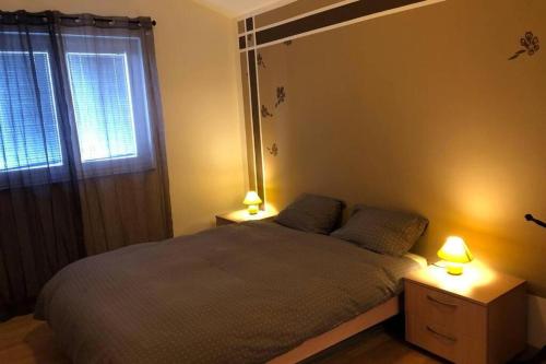 Posteľ alebo postele v izbe v ubytovaní Apartments Sandro