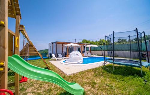 a playground with a slide and a swimming pool at Stunning Home In Cerovacki Galovici in Galović-Selo