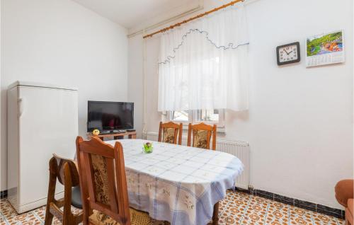 Televízia a/alebo spoločenská miestnosť v ubytovaní Apartment Vocarska Ii