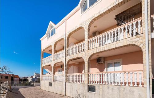 a building with balconies on the side of it at 2 Bedroom Nice Apartment In Rtina in Rtina