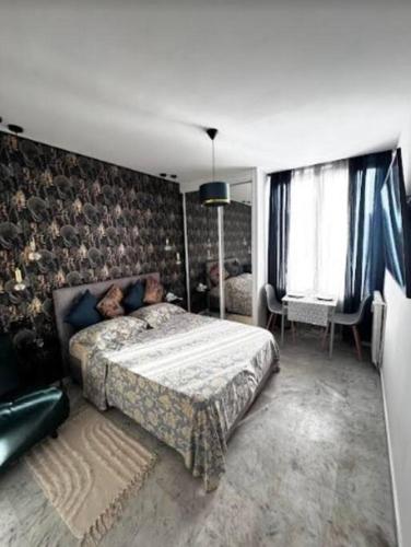 Ένα ή περισσότερα κρεβάτια σε δωμάτιο στο Studio en bord de mer, Plage 20m, Clim