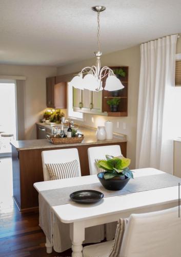 a kitchen with a table with chairs and a dining room at Beautiful House 2 bedroom in Belleville