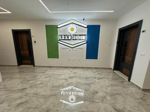 a room with a new championship sign on the wall at EKAM Sun Apartments in Golem