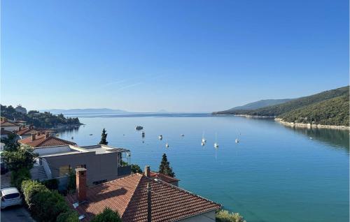 a view of a lake with boats in the water at Apartment Rudarska V in Rabac