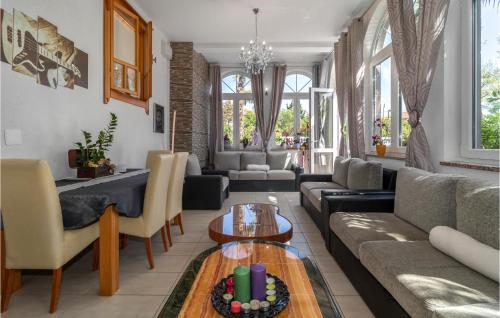 a living room with a couch and a table at 6 Bedroom Beautiful Home In Crikvenica in Crikvenica