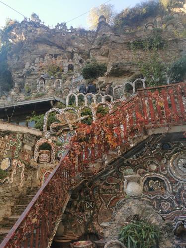 an ornate staircase with a mountain in the background at Residenza Le Torri in Tirano