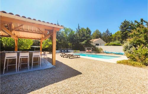 a patio with a gazebo and a swimming pool at Beautiful Home In Prades-Sur-Vernazobre in Prades-sur-Vernazobre