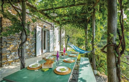 a table with plates of food sitting on a patio at S Rocco Dimora Tra Ulivi E M in Zoagli
