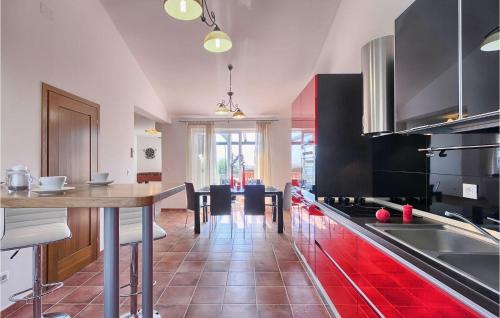 a kitchen with a table and some chairs in it at Villa Vera in Poreč