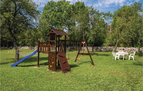 a playground with a slide and a swing set at Gorgeous Home In Gracac With Kitchen in Gračac