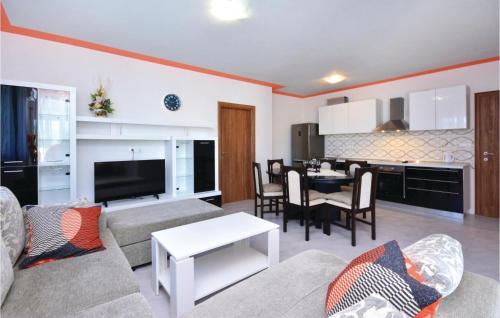 a living room with a couch and a table at Gorgeous Home In Solin in Solin