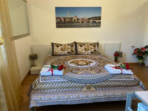 a bedroom with a bed with a plate on it at Arena d'Intorno in Verona