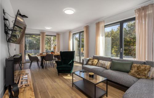 a living room with a couch and a table at Nice Home In Stari Laz With Kitchen in Stari Laz