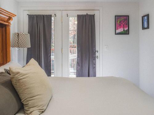 a bedroom with a white bed and a window at NEW LISTING Sasquatch Lodge F in Gatlinburg