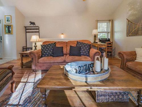 a living room with a couch and a coffee table at NEW LISTING Sasquatch Lodge F in Gatlinburg