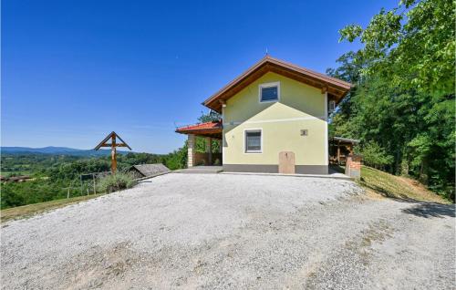 a house on the side of a dirt road at Amazing Home In Susobreg With Wifi in Jertovec