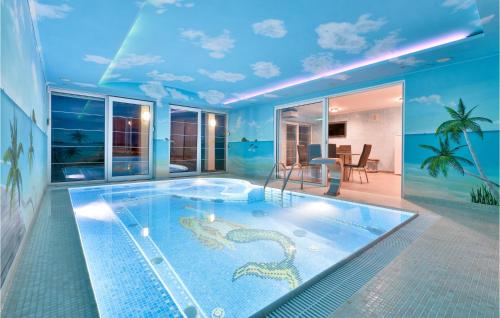a large swimming pool with a snake in a house at Cozy Home In Varazdinske Toplice in Varaždinske Toplice