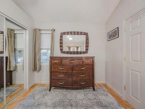 a room with a dresser with a mirror on it at NEW LISTING Sasquatch Lodge F in Gatlinburg
