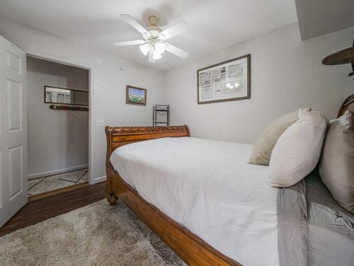 a bedroom with a bed with a ceiling fan at NEW LISTING Sasquatch Lodge F in Gatlinburg