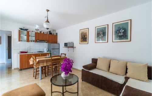 a living room with a couch and a table at Beautiful Apartment In Premantura in Premantura