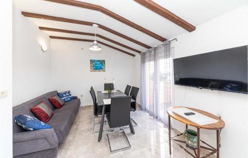 a living room with a couch and a table at Cozy Apartment In Sevid With Wifi in Sevid