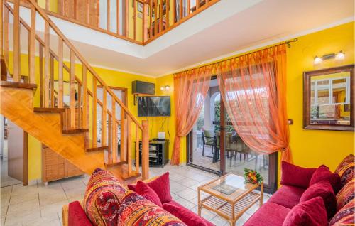 a living room with a red couch and yellow walls at Nice Home In Njivice With Wifi in Njivice