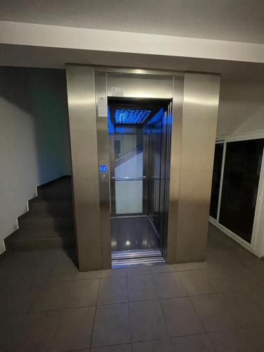 an elevator in a building with the door open at Apartment in the Villa Northern Dreams #2 PARKING INCLUDED IN PRICE in Timişoara