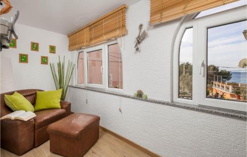 a living room with a couch and a window at Cozy Home In Miholascica With Wifi in Miholašćica