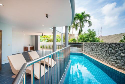 an image of a swimming pool on the balcony of a house at patong villa3 四卧海景泳池别墅 近班赞海鲜市场 中英泰三语服务 in Patong Beach