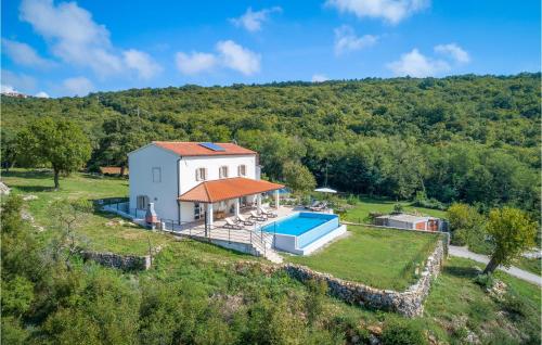 an aerial view of a house with a swimming pool at Awesome Home In Labin With Wifi in Labin