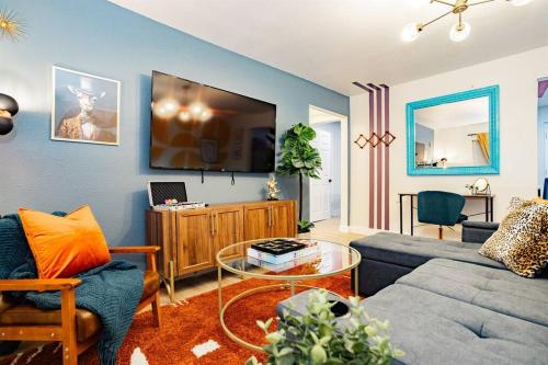 a living room with a couch and a table at Star Motel Unit 2- Luxury Las Vegas Vacation Home Arts District Oasis in Las Vegas