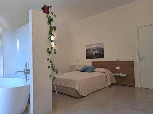 Ένα ή περισσότερα κρεβάτια σε δωμάτιο στο B&B LE MAGNOLIE