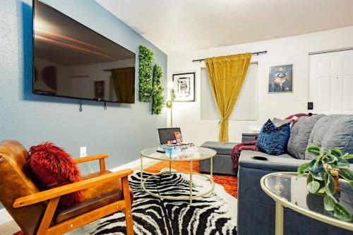 a living room with a couch and a table at Star Motel Unit 3- New Premier & Private Las Vegas Arts District Home in Las Vegas