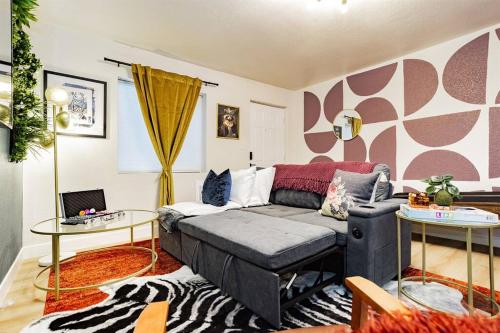a living room with a couch and a table at Star Motel Unit 3- New Premier & Private Las Vegas Arts District Home in Las Vegas
