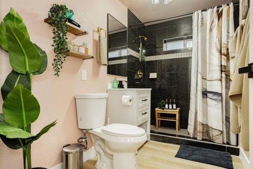 a bathroom with a white toilet and a shower at Star Motel Unit 3- New Premier & Private Las Vegas Arts District Home in Las Vegas