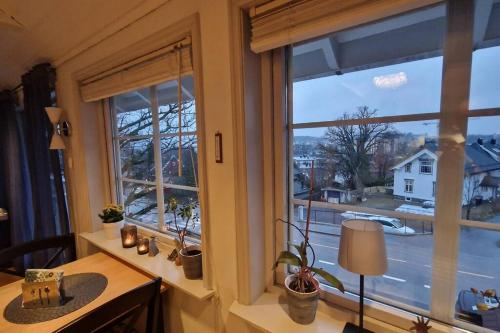 a room with a desk and a window with a view at Solrikt med kort avstand til byen in Sandefjord