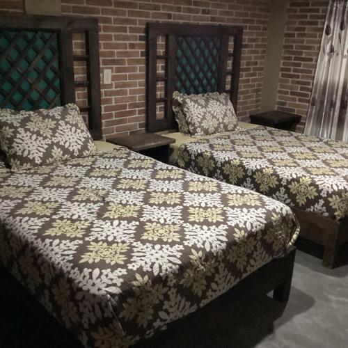 Cama o camas de una habitación en Hotel las carretas , spa y temazcal