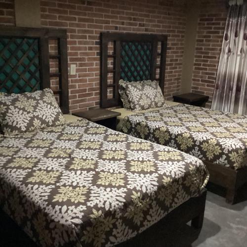 Cama o camas de una habitación en Hotel las carretas , spa y temazcal