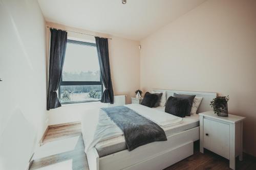 Katil atau katil-katil dalam bilik di Baltica Heaven by 2HomeRent