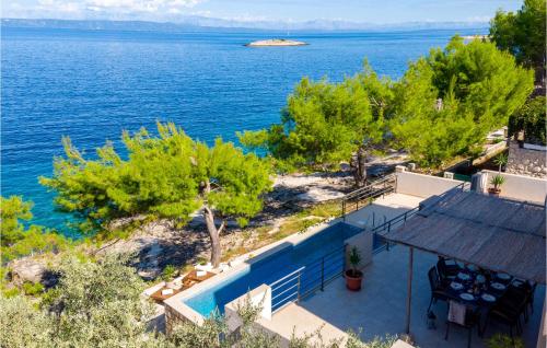 a house with a view of the water at Beautiful Home In Prigradica in Prigradica
