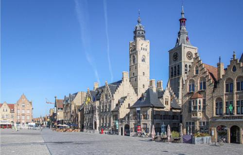 a building with two towers on a city street at Amazing Home In Diksmuide With Wifi in Diksmuide