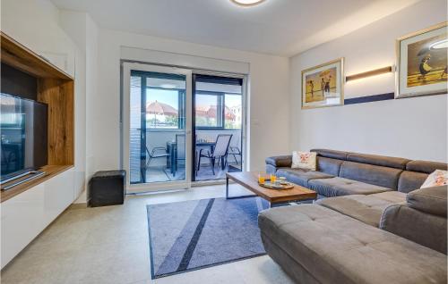 a living room with a couch and a table at 2 Bedroom Cozy Apartment In Zaton in Zaton